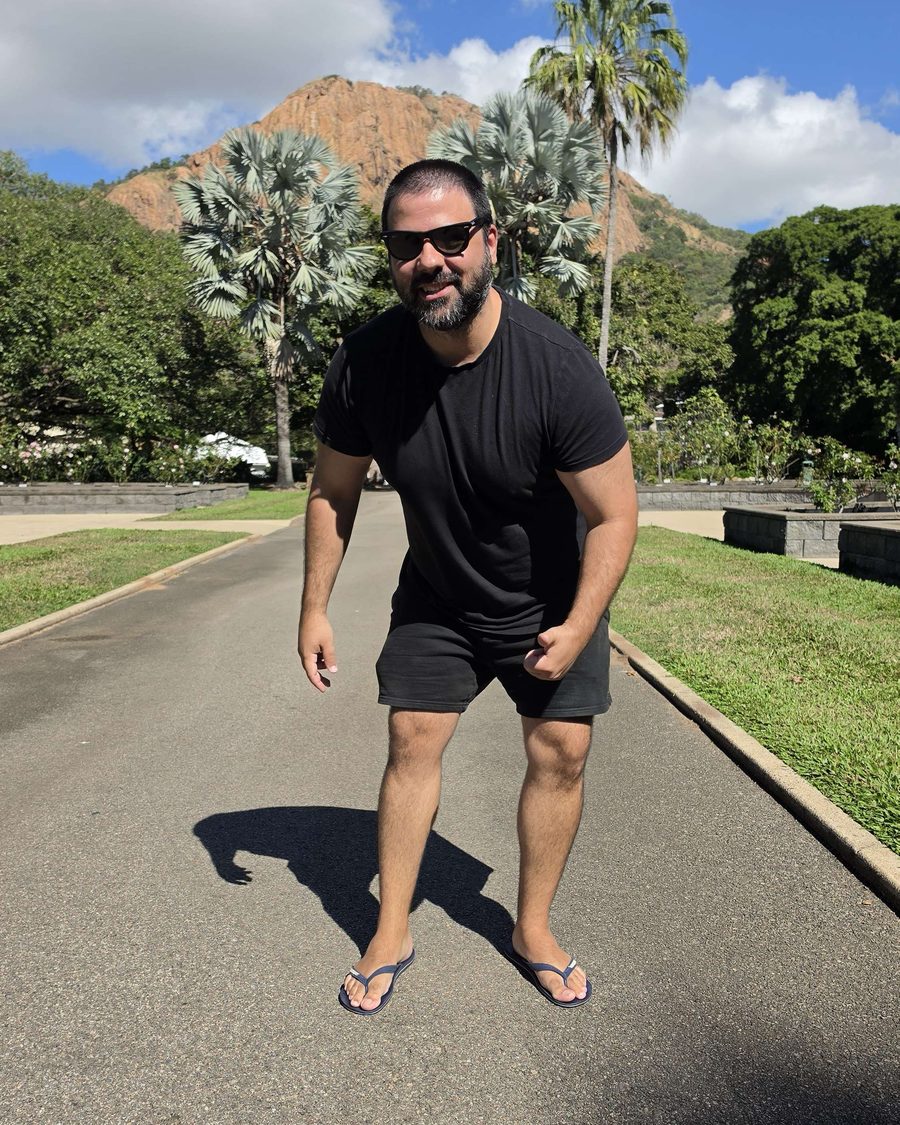 Ross, founder of Kleros, standing in front of Castle Hill in Townsville